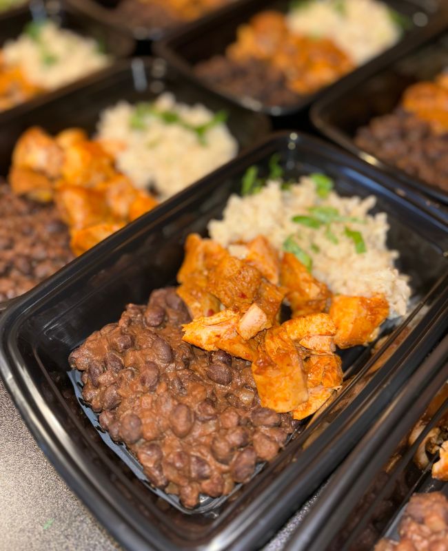 Meal prep bowl with black beans, rice, and chicken