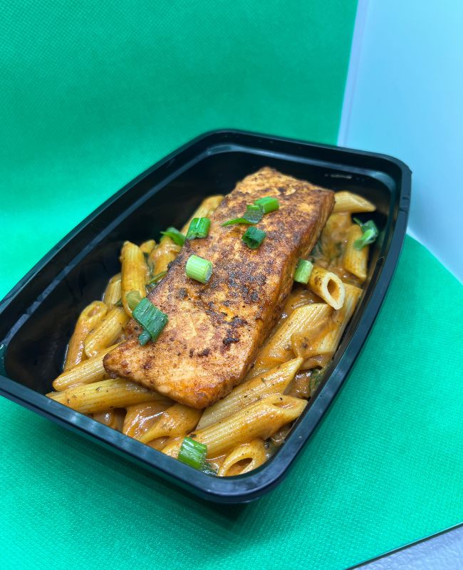 Meal prep bowl with salmon and pasta