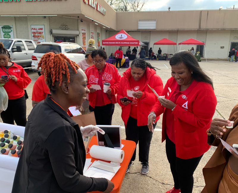 Several customers shopping at a Right Tract display